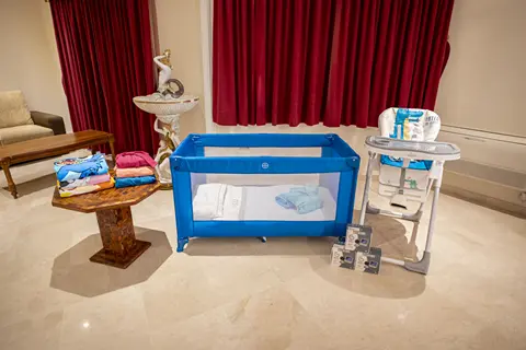 Cot high chair and baby monitor prepared for family stays at Villa Monaco Adeje Tenerife Cot high chair and baby monitor prepared for family stays at Villa Monaco Adeje Tenerife